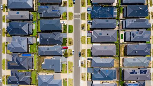 Crowded residential neighborhood with homes on small lots seen from above