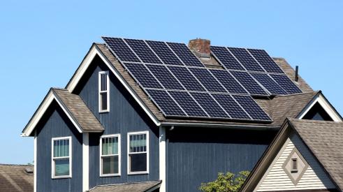 Solar panels on residential home rooftop power electrical systems in the home