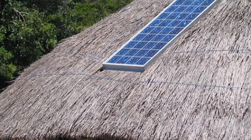 Solar panel on thatch hut roof