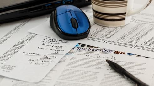 tax forms, mouse, coffee mug