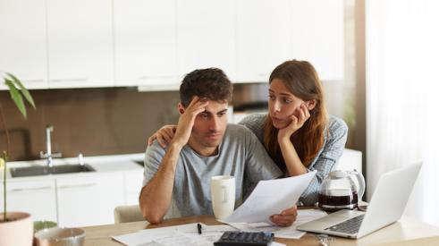 Unhappy Couple Crunching Numbers