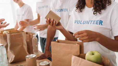 Volunteers packing bags at a food bank