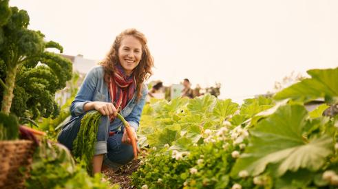 Woman smiling while farming
