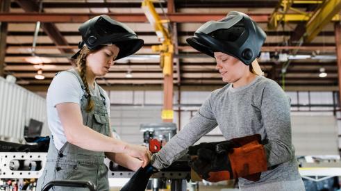 Young women welders at work
