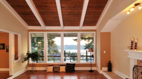 Dark wood paneling on living room ceiling