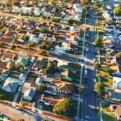 Aerial view of neighborhood of single-family homes, which are becoming increasingly difficult to afford