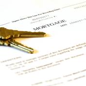 Mortgage application form and set of brass keys