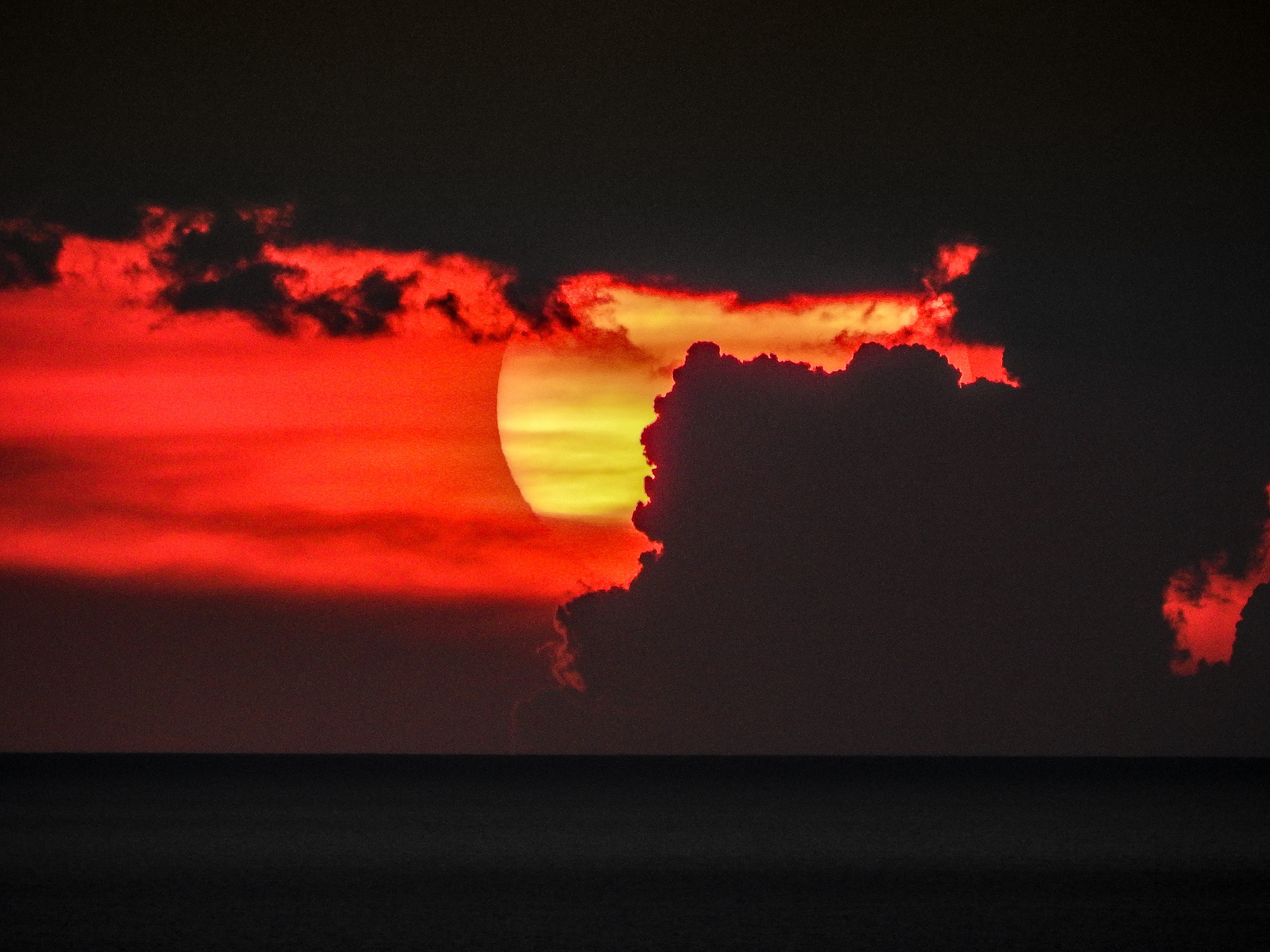 Sunset behind a cloud
