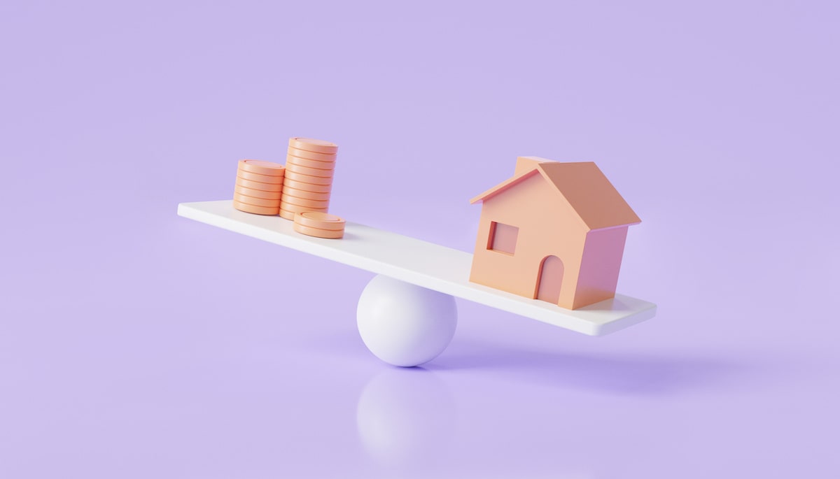 Purple background and white scale with coins and house tipping toward house