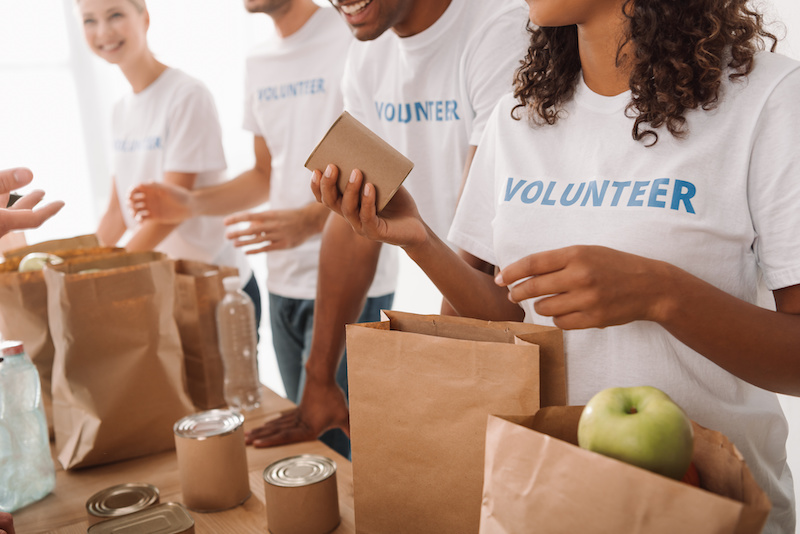 Volunteers packing bags at a food bank