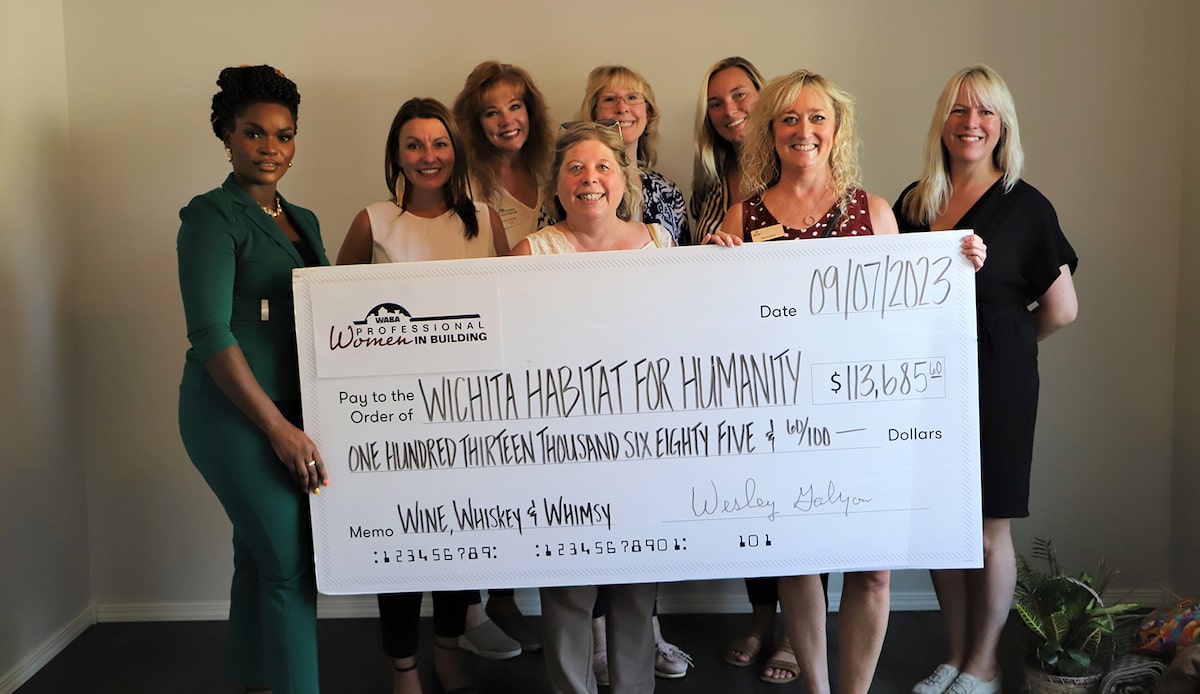 Wichita Professional Women in Building Council presenting a fundraising check 