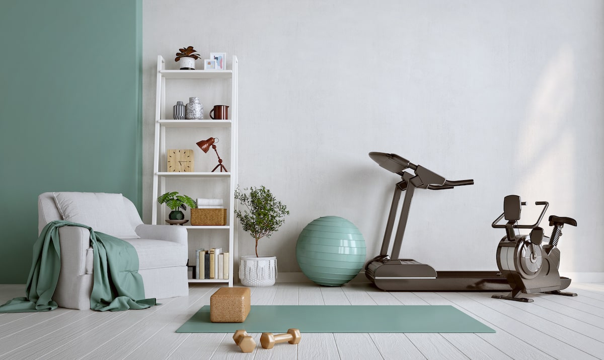 Wellness room with recliner, yoga mat, stationary bike, and exercise ball