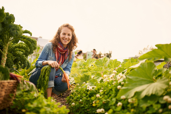 Woman smiling while farming