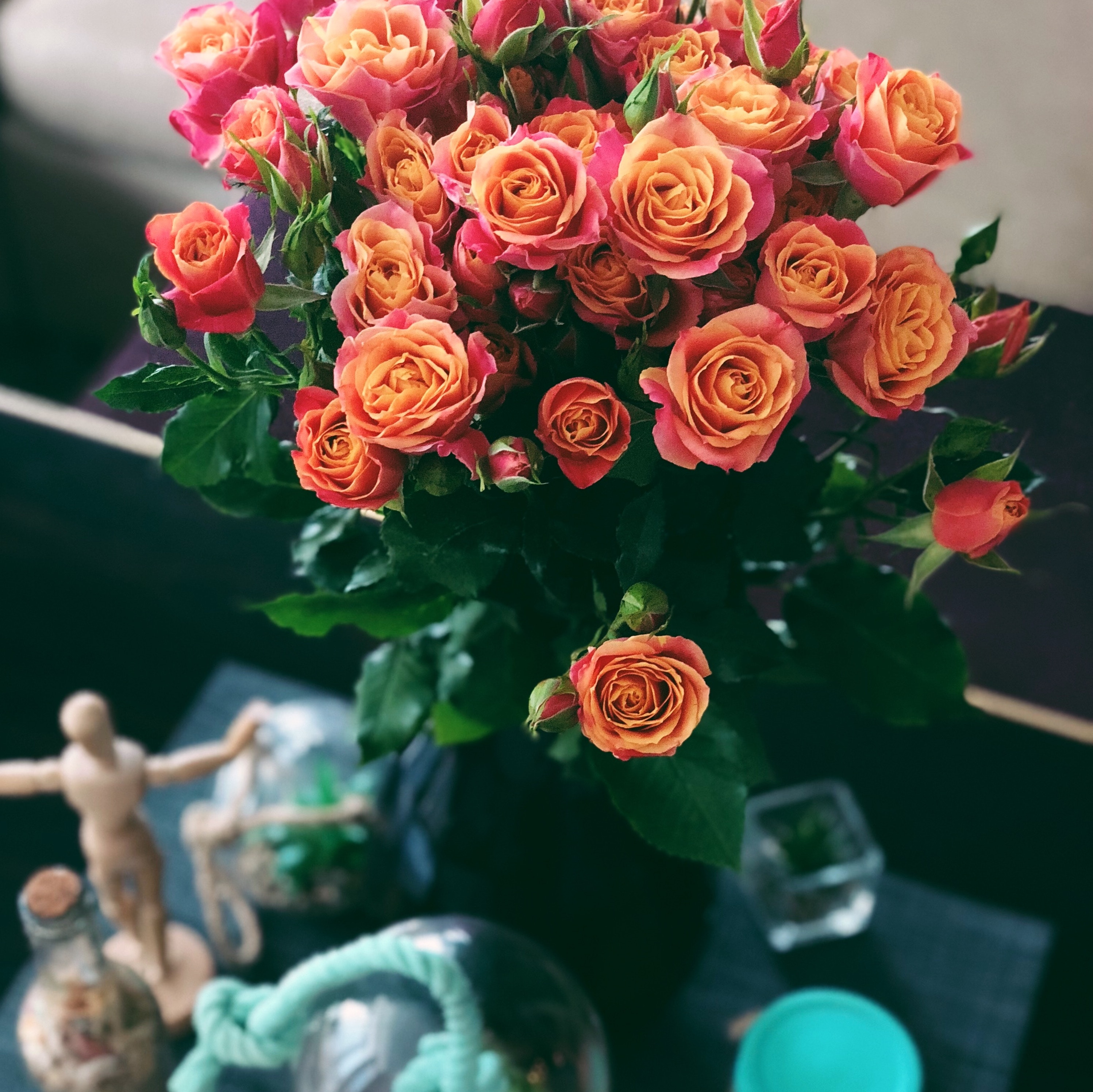 Bouquet of roses with other accoutrements on table