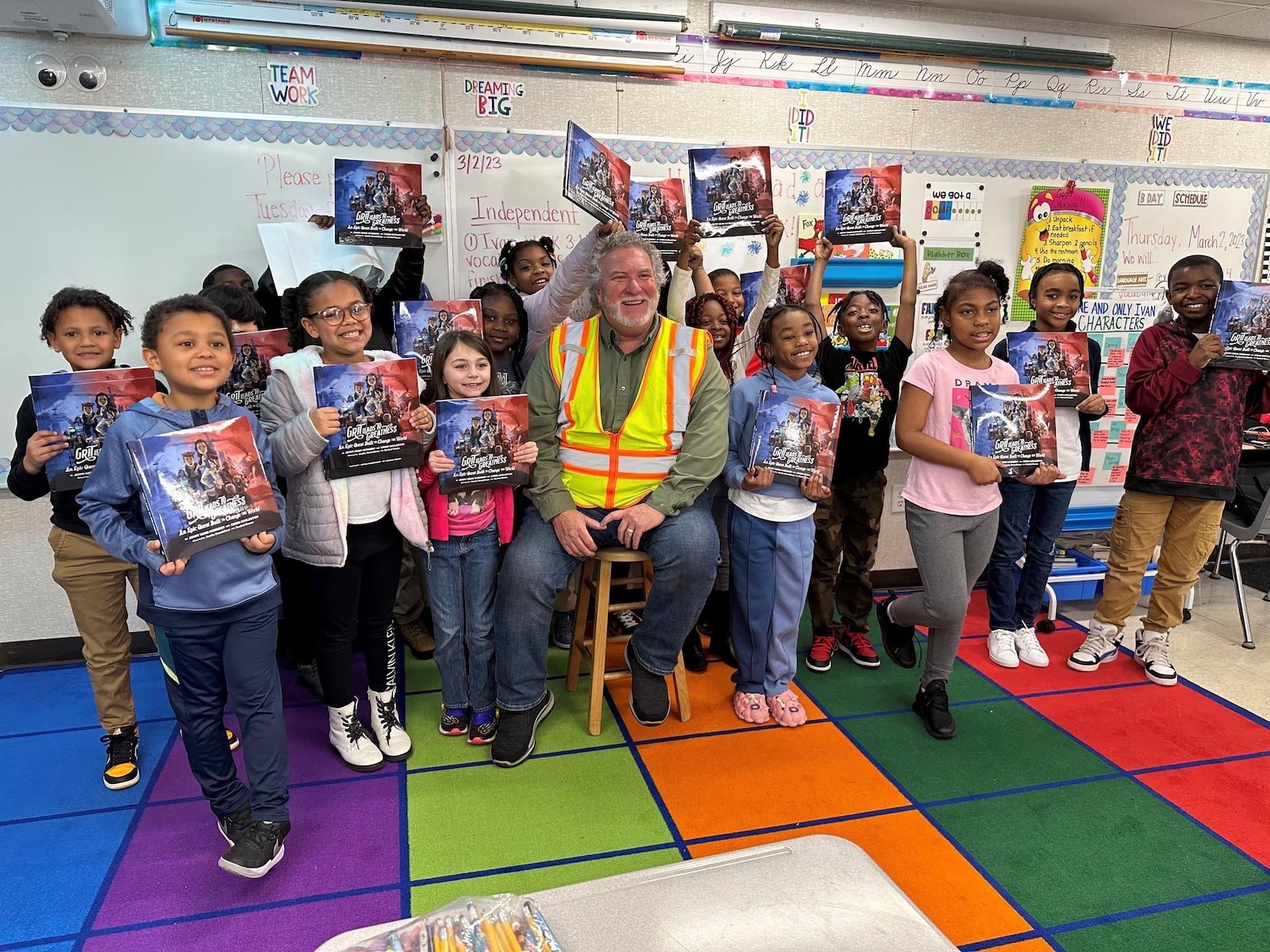 "Grit Leads to Greatness" book reading by a builder to kids in the classroom