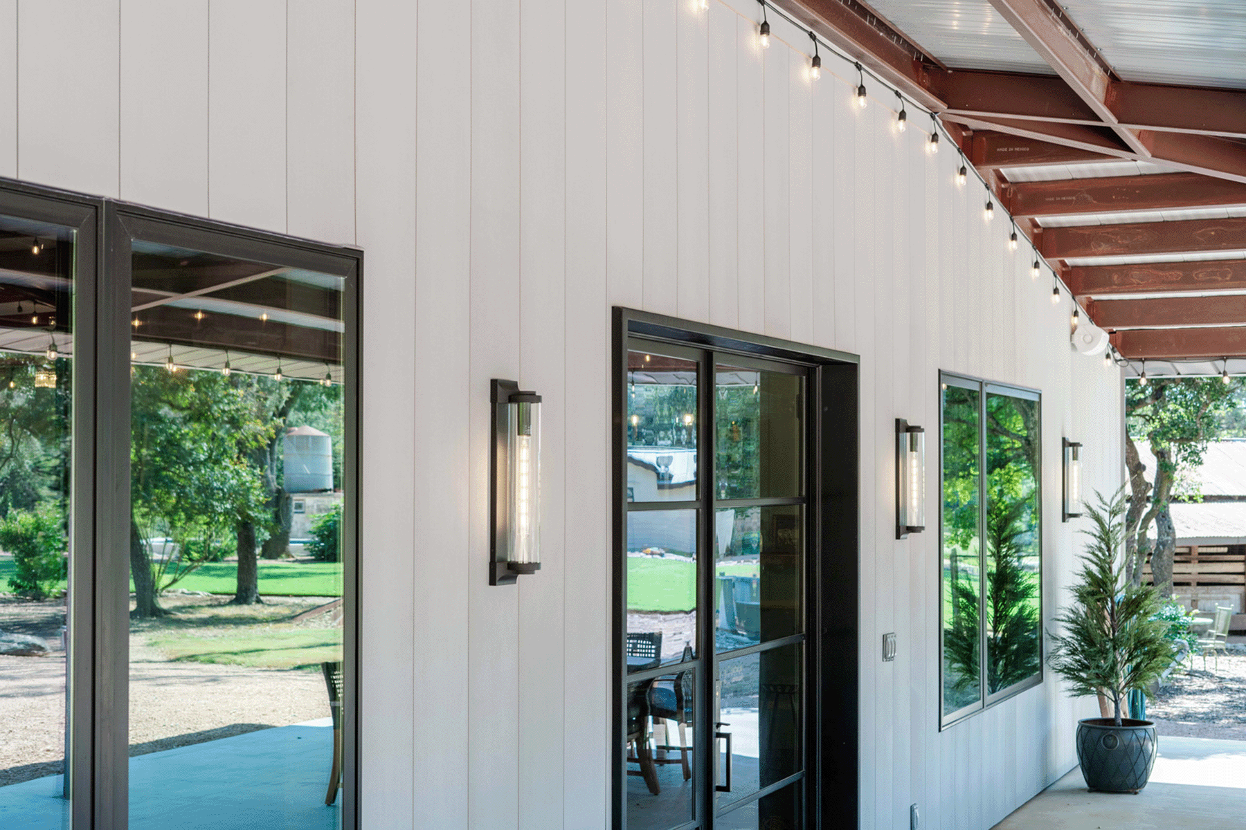 Austin barn house vertical siding with Acre sheets