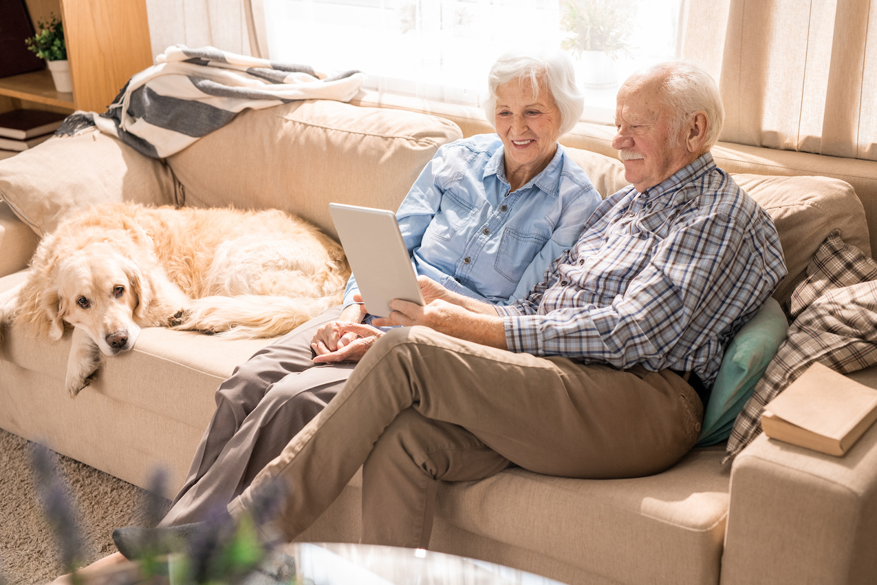 Two old people sitting at home