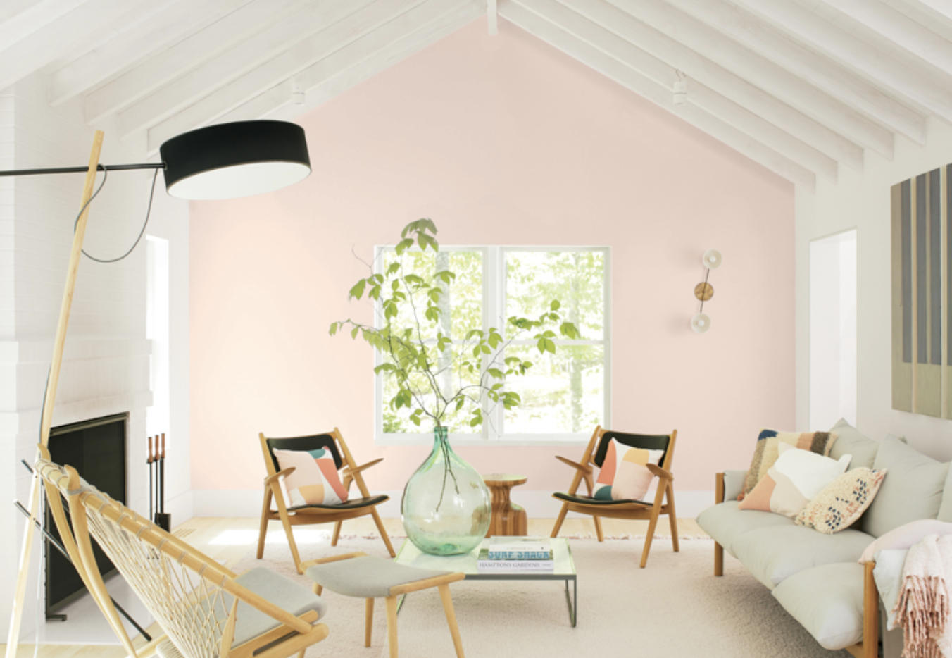 living room painted Benjamin Moore's Color of the Year, First Light, a light-pink hue