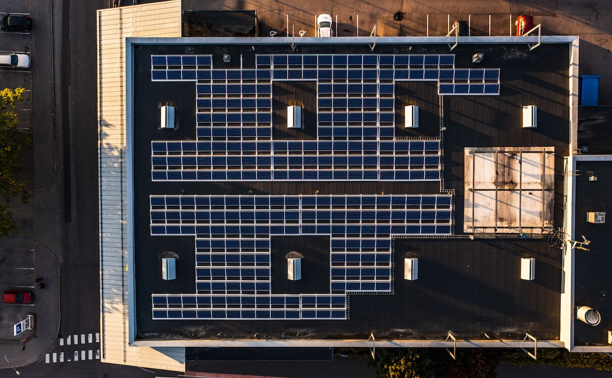 Apartment building aerial view of rooftop solar