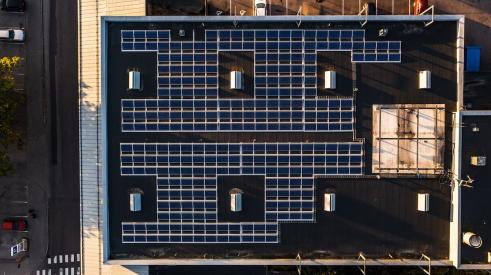 Apartment building aerial view of rooftop solar