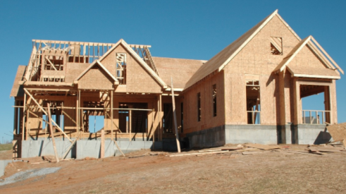 house framed and walls up in a house being built using strict quality assurance measures